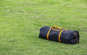 Backpack tents on the lawn.