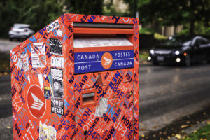 Vancouver, British Columbia, Canada  September 27, 2024: A Canada post office box on a neighborhood street corner in Vancouver, BC, Canada.